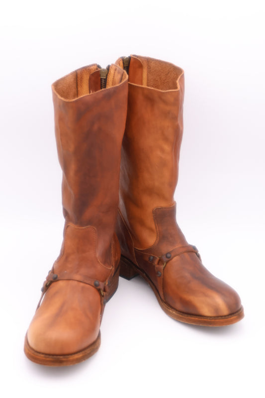 Pair of brown leather boots on a white background