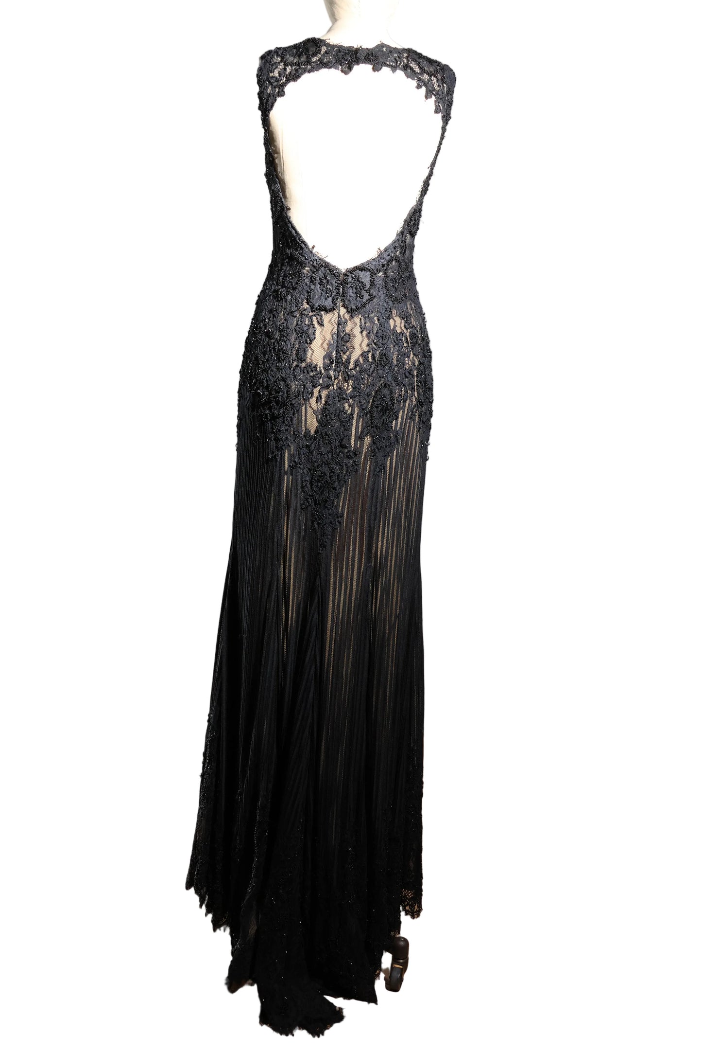 Black lace evening gown on a mannequin against a plain background