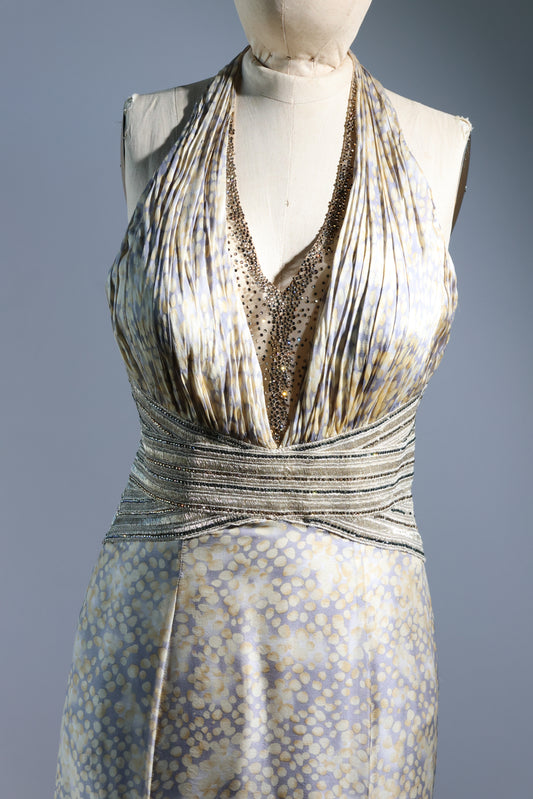 Patterned dress on a mannequin against a gray background